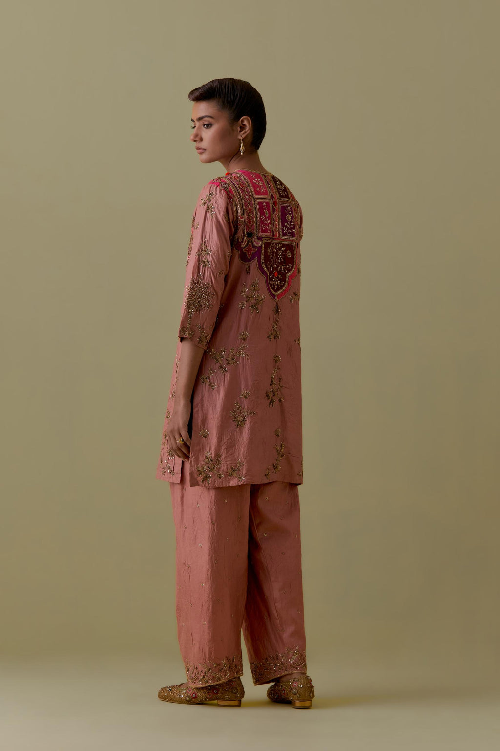 Peach Silk Short Kurta set with Multicoloured Appliqué & Handwork.