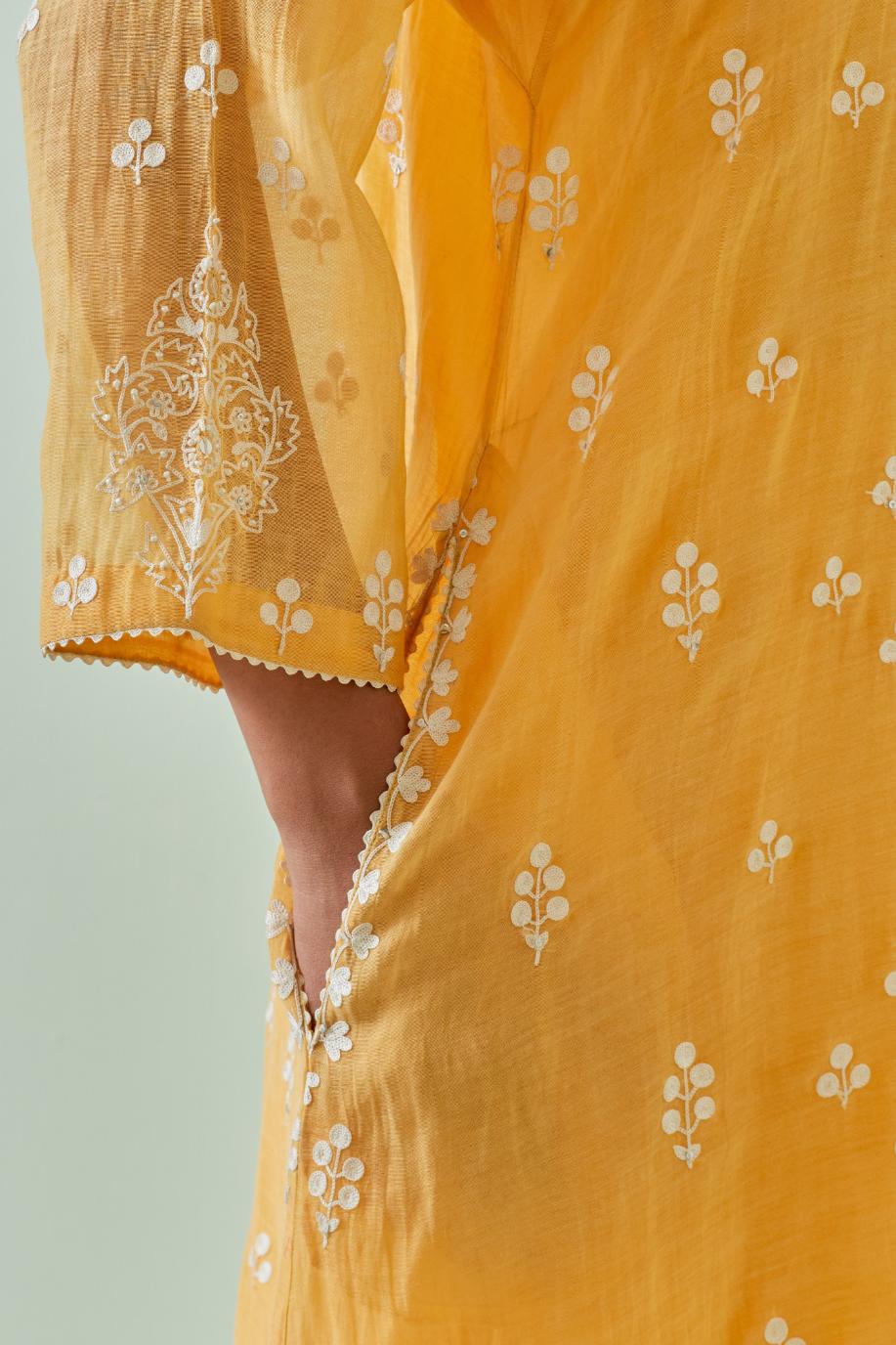 Yellow kalidar cotton chanderi short kurta set, highlighted with delicate off-white embroidery.