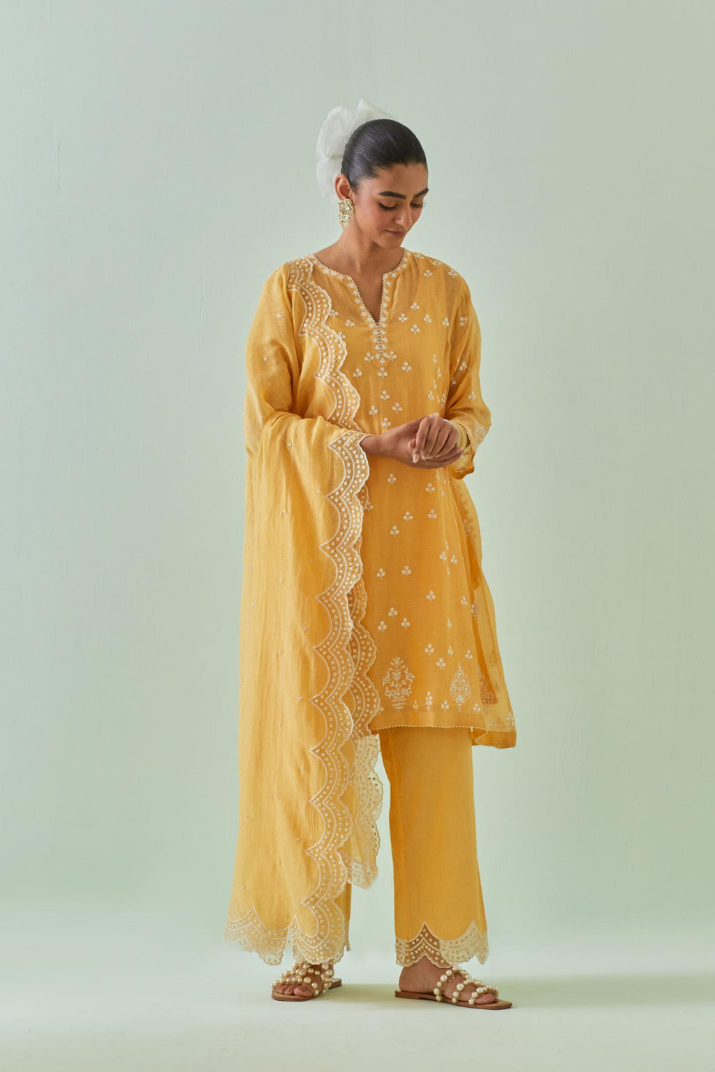 Yellow cotton chanderi dupatta with scalloped and embroidered edges.