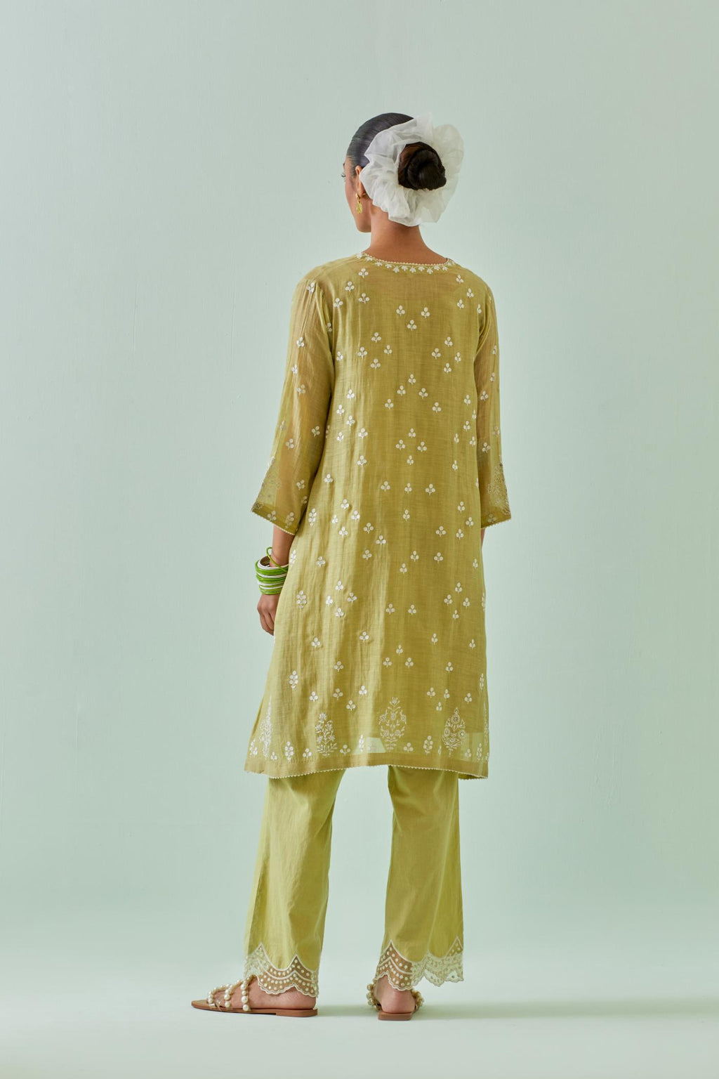 Green kalidar cotton chanderi short kurta set, highlighted with delicate off-white embroidery.