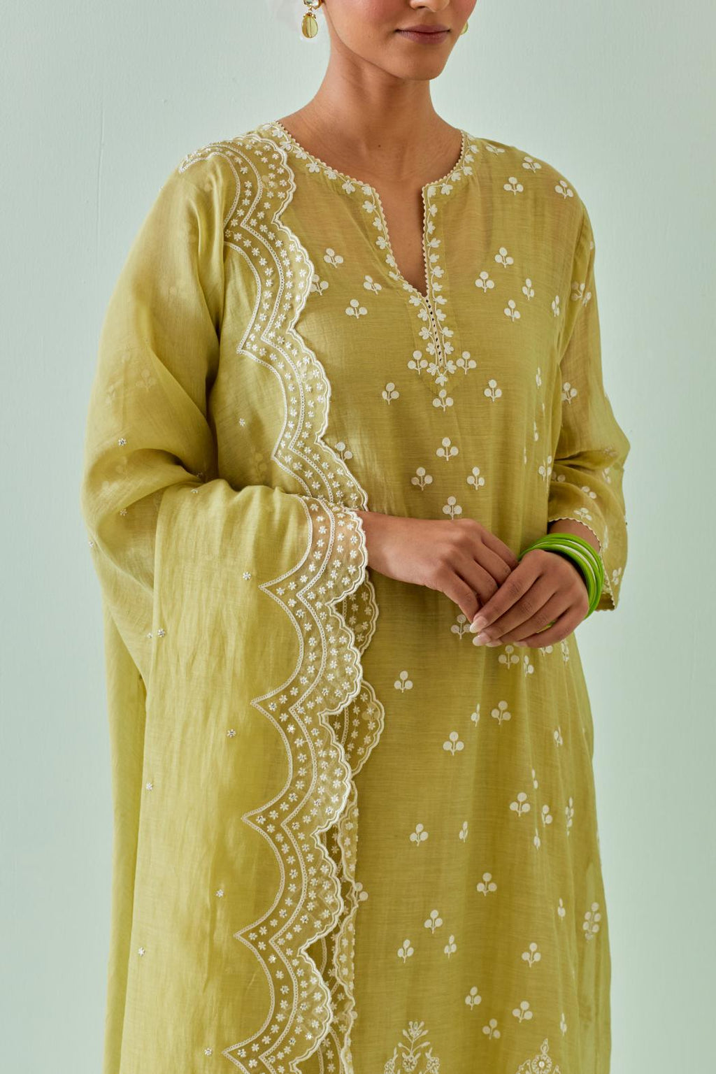 Green kalidar cotton chanderi short kurta set, highlighted with delicate off-white embroidery.