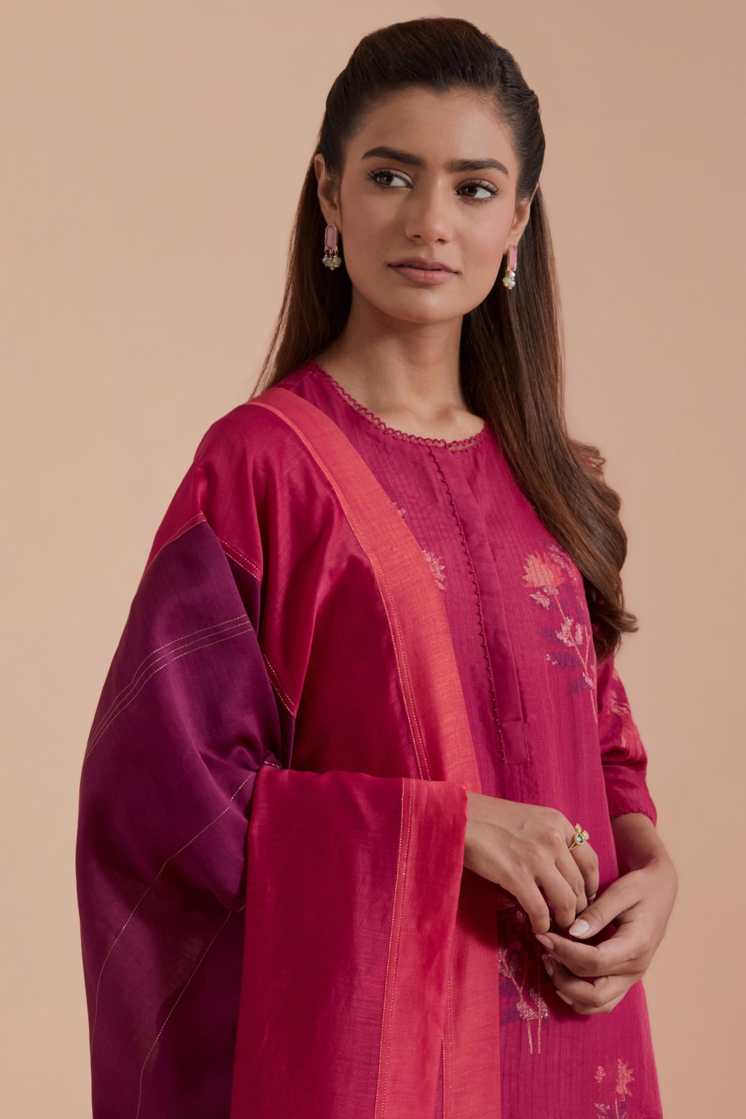 A silk chanderi three-tone dupatta in a beautiful gradient effect featuring delicate golden zari quilting all over.