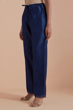 Blue silk chanderi straight pants detailed with scalloped organza edging at the hem, delicately highlighted with gold zari quilting.