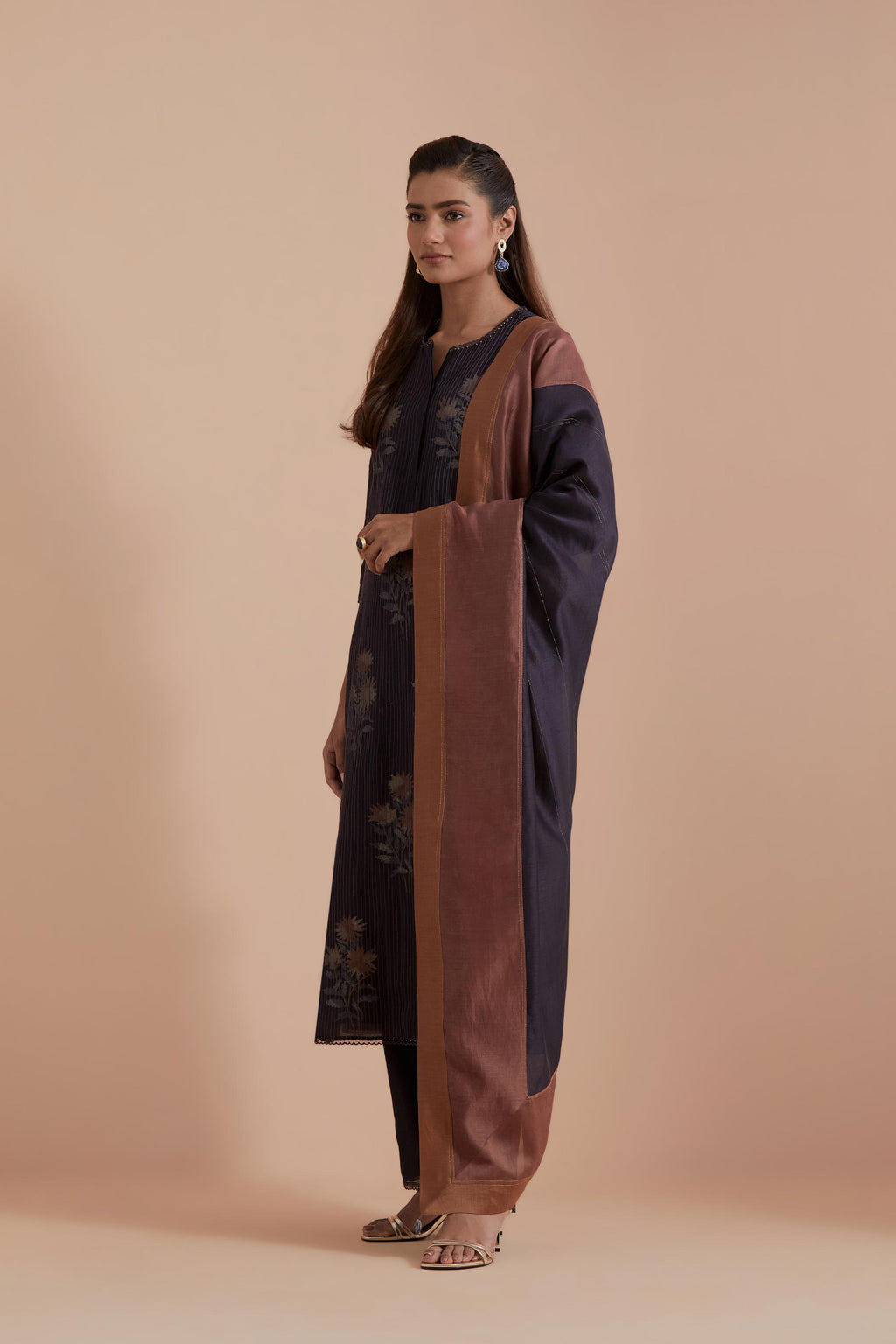 A silk chanderi three-tone dupatta in a beautiful gradient effect featuring delicate golden zari quilting all over.