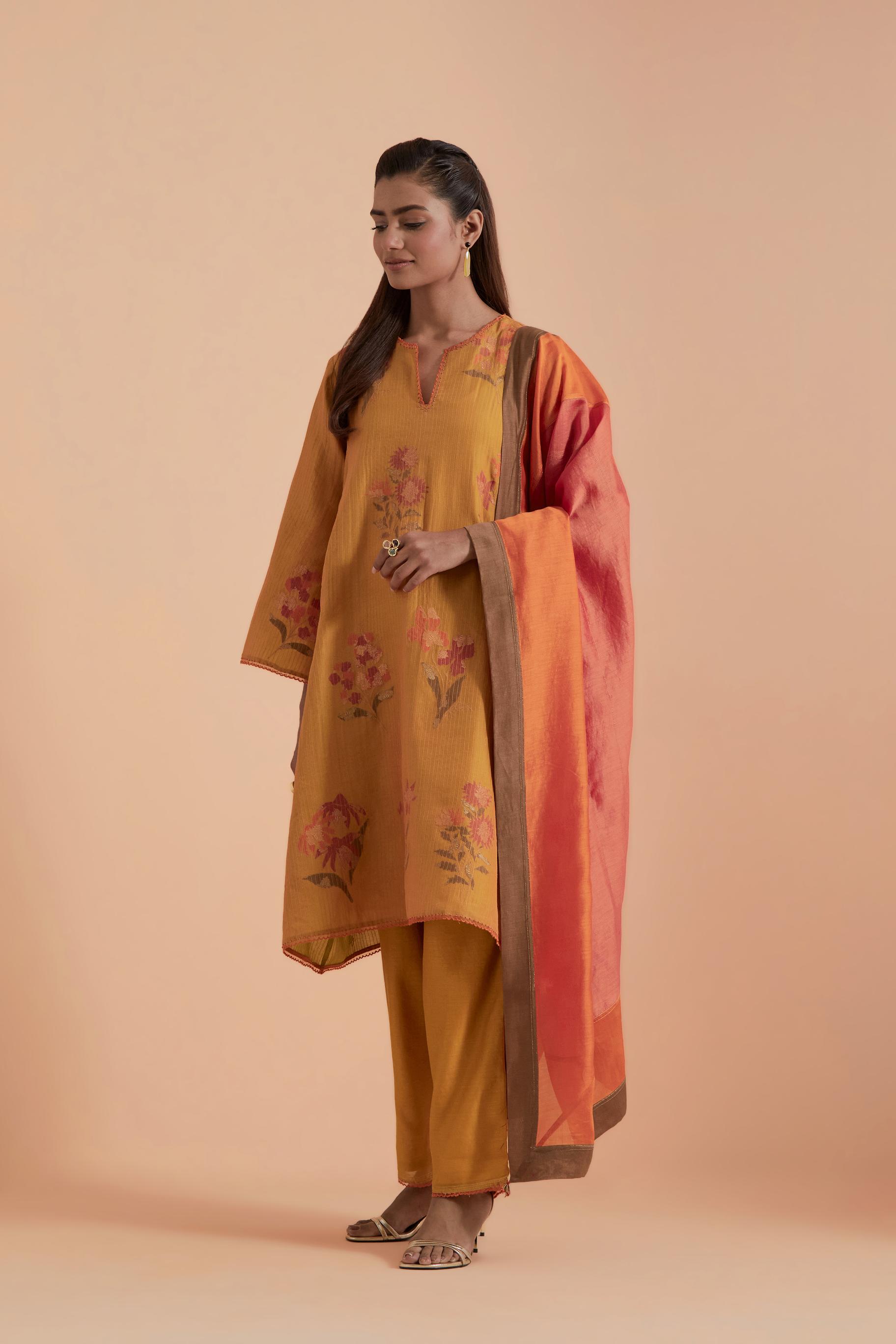 A silk chanderi three-tone dupatta in a beautiful gradient effect featuring delicate golden zari quilting all over.