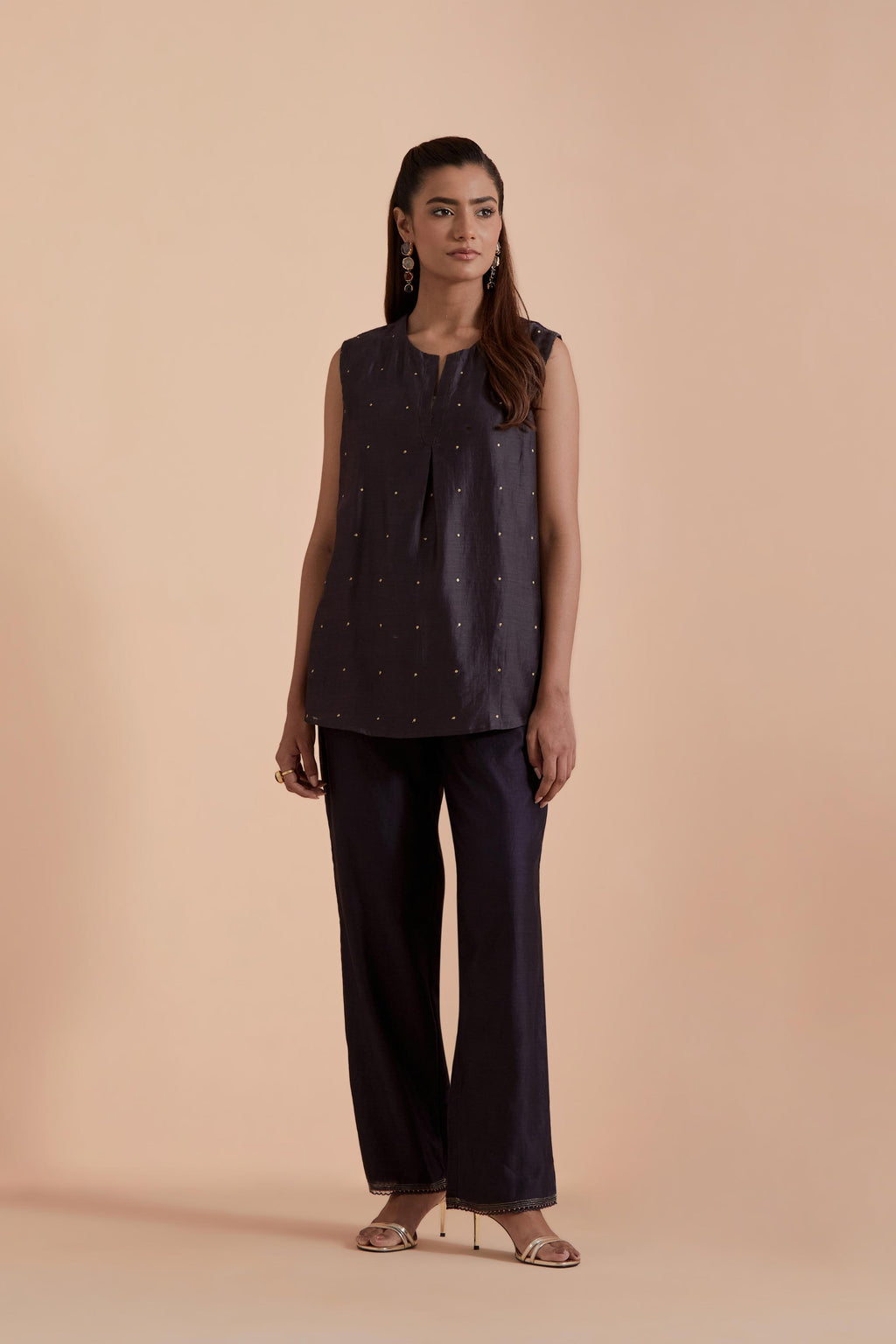 Dark grey short front open A-line jacket set layered with quilted Silk Organza and delicate Silk Brocade floral appliquéd bootas. Paired with dark grey silk chanderi straight pants
