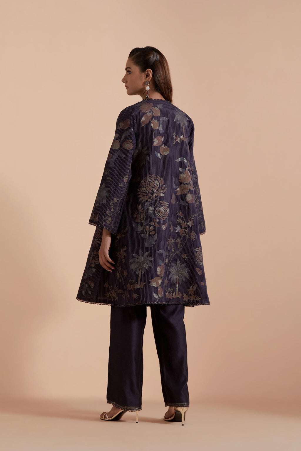 Dark grey short front open A-line jacket set layered with quilted Silk Organza and delicate Silk Brocade floral appliquéd bootas. Paired with dark grey silk chanderi straight pants