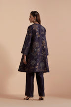 Dark grey short front open A-line jacket set layered with quilted Silk Organza and delicate Silk Brocade floral appliquéd bootas. Paired with dark grey silk chanderi straight pants
