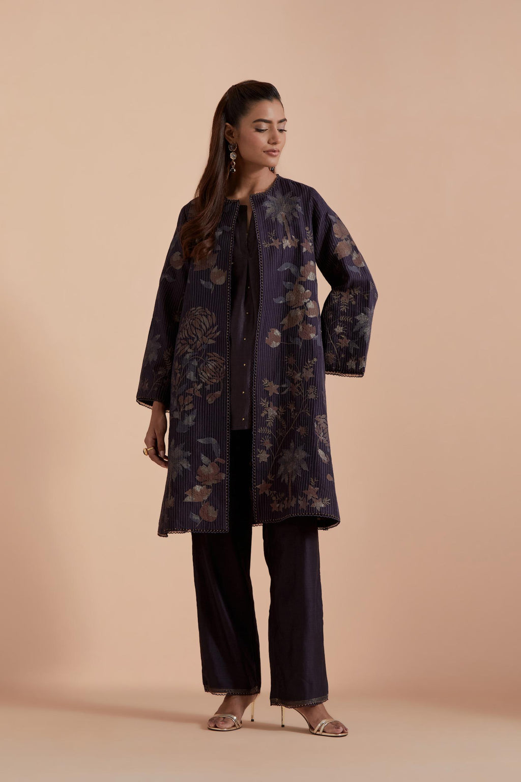 Dark grey short front open A-line jacket set layered with quilted Silk Organza and delicate Silk Brocade floral appliquéd bootas. Paired with dark grey silk chanderi straight pants