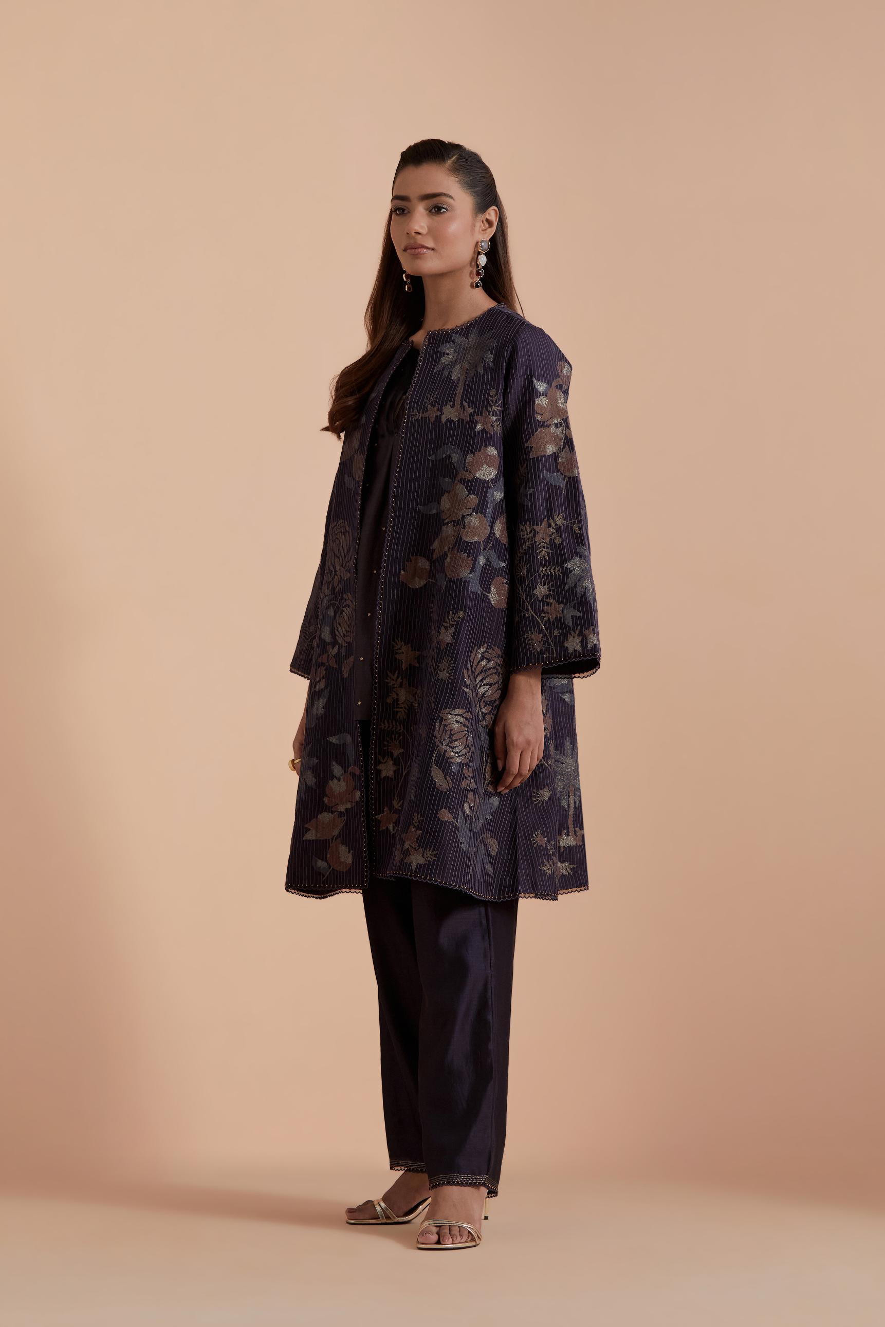 Dark grey short front open A-line jacket set layered with quilted Silk Organza and delicate Silk Brocade floral appliquéd bootas. Paired with dark grey silk chanderi straight pants