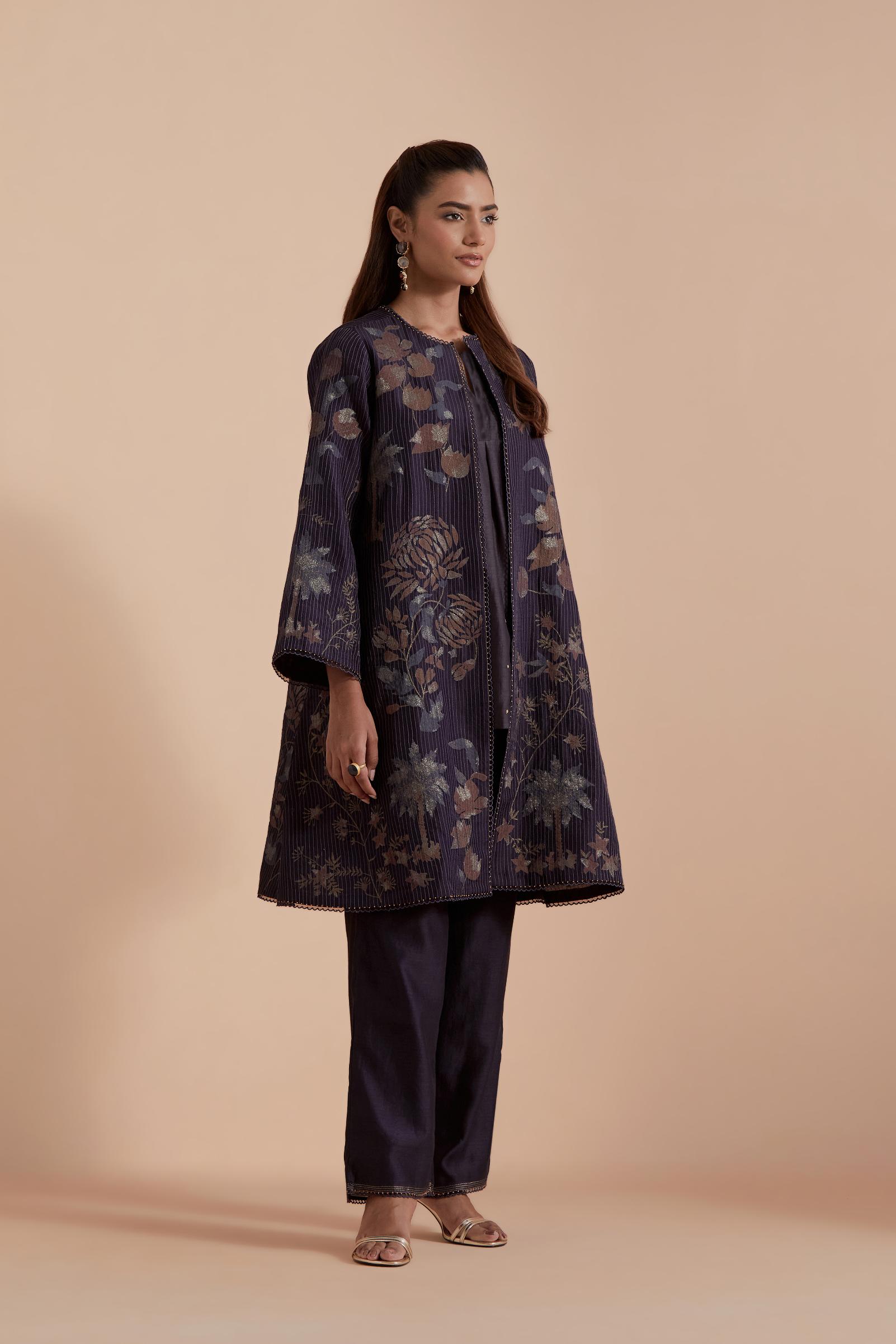 Dark grey short front open A-line jacket set layered with quilted Silk Organza and delicate Silk Brocade floral appliquéd bootas. Paired with dark grey silk chanderi straight pants