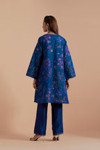 Blue short front open A-line jacket set layered with quilted Silk Organza and delicate Silk Brocade floral appliquéd bootas. Paired with Blue silk chanderi straight pants