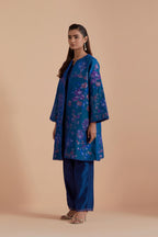 Blue short front open A-line jacket set layered with quilted Silk Organza and delicate Silk Brocade floral appliquéd bootas. Paired with Blue silk chanderi straight pants
