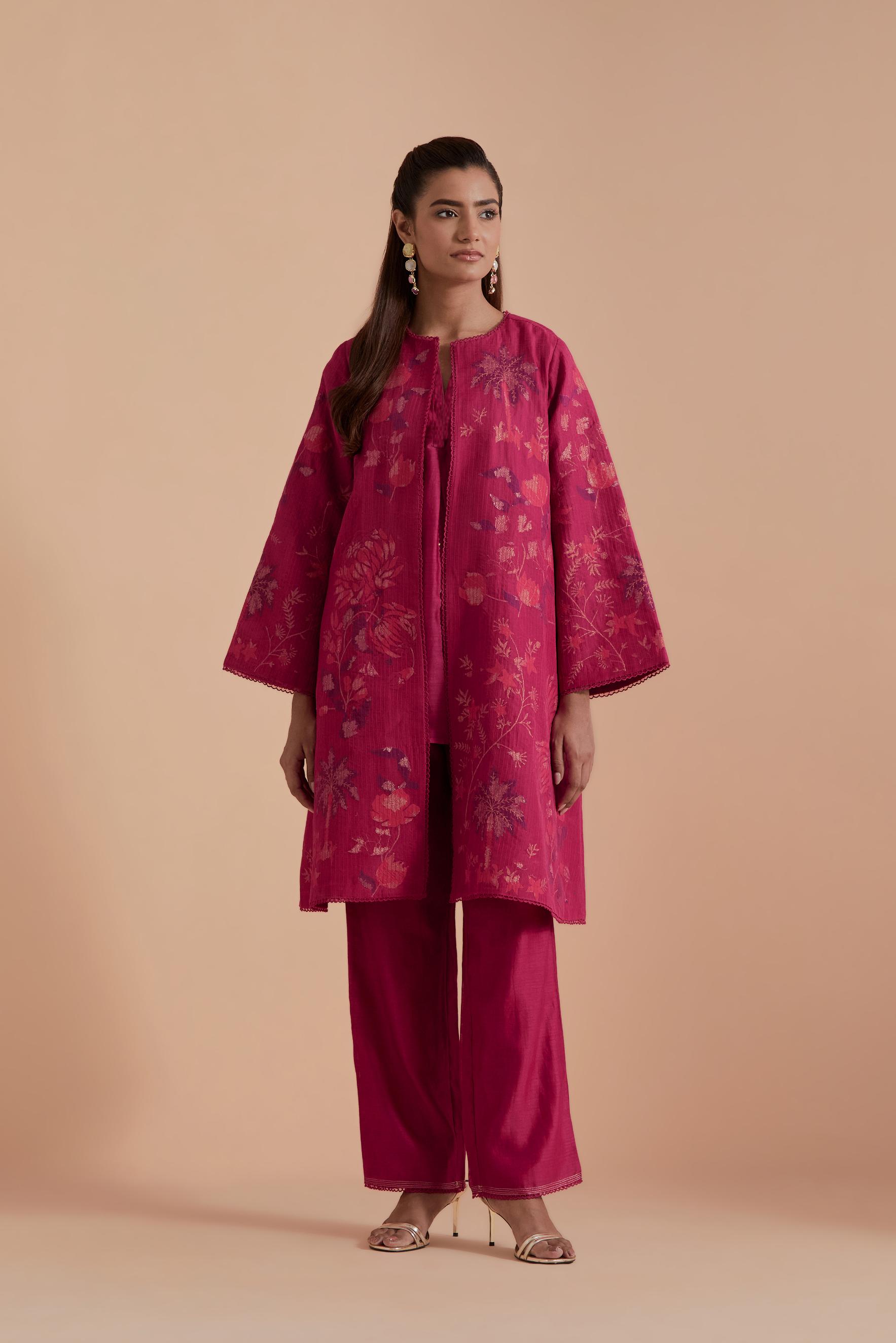Fuchsia short front open A-line jacket set layered with quilted Silk Organza and delicate Silk Brocade floral appliquéd bootas. Paired with fuchsia silk chanderi straight pants.