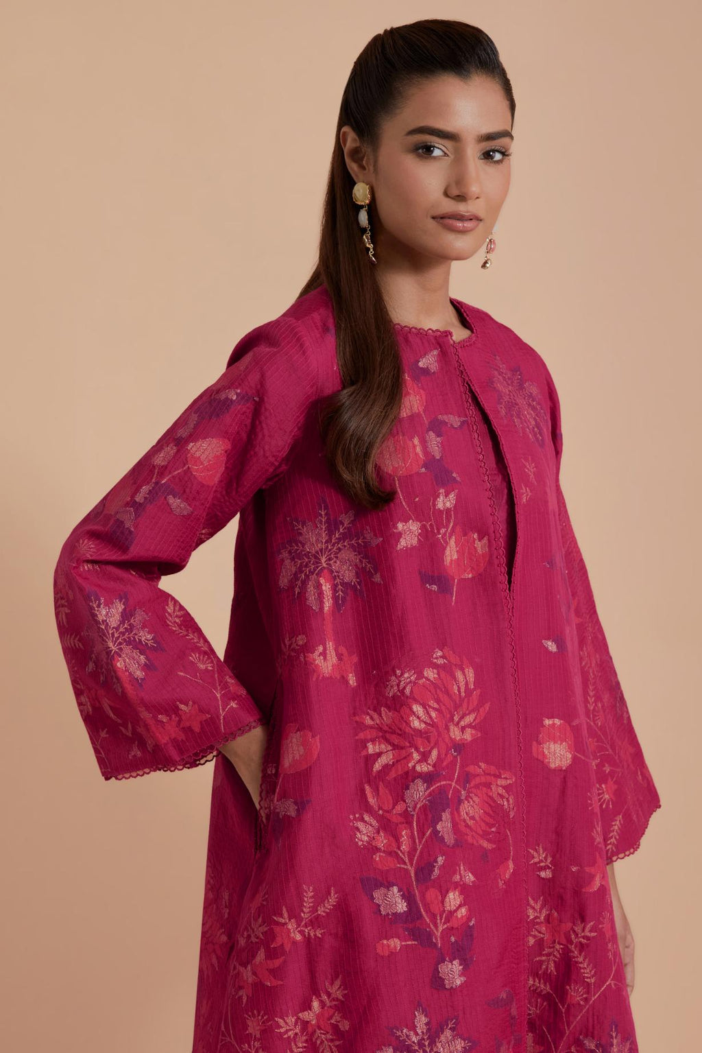 Fuchsia short front open A-line jacket set layered with quilted Silk Organza and delicate Silk Brocade floral appliquéd bootas. Paired with fuchsia silk chanderi straight pants.