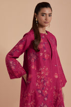 Fuchsia short front open A-line jacket set layered with quilted Silk Organza and delicate Silk Brocade floral appliquéd bootas. Paired with fuchsia silk chanderi straight pants.