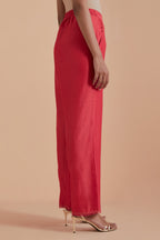 Orange silk chanderi straight pants detailed with scalloped organza edging at the hem, delicately highlighted with gold zari quilting.