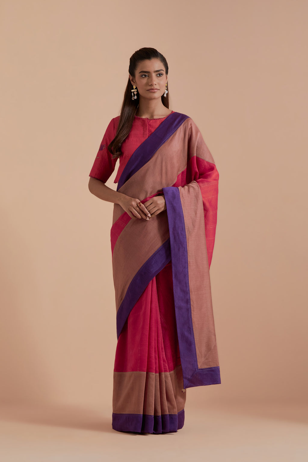 A silk Chanderi three-tone Carrot pink saree in a beautiful gradient effect featuring delicate golden zari quilting all over. Paired with Carrot pink silk Chanderi Quilted Organza & Brocade Floral Appliqué blouse.