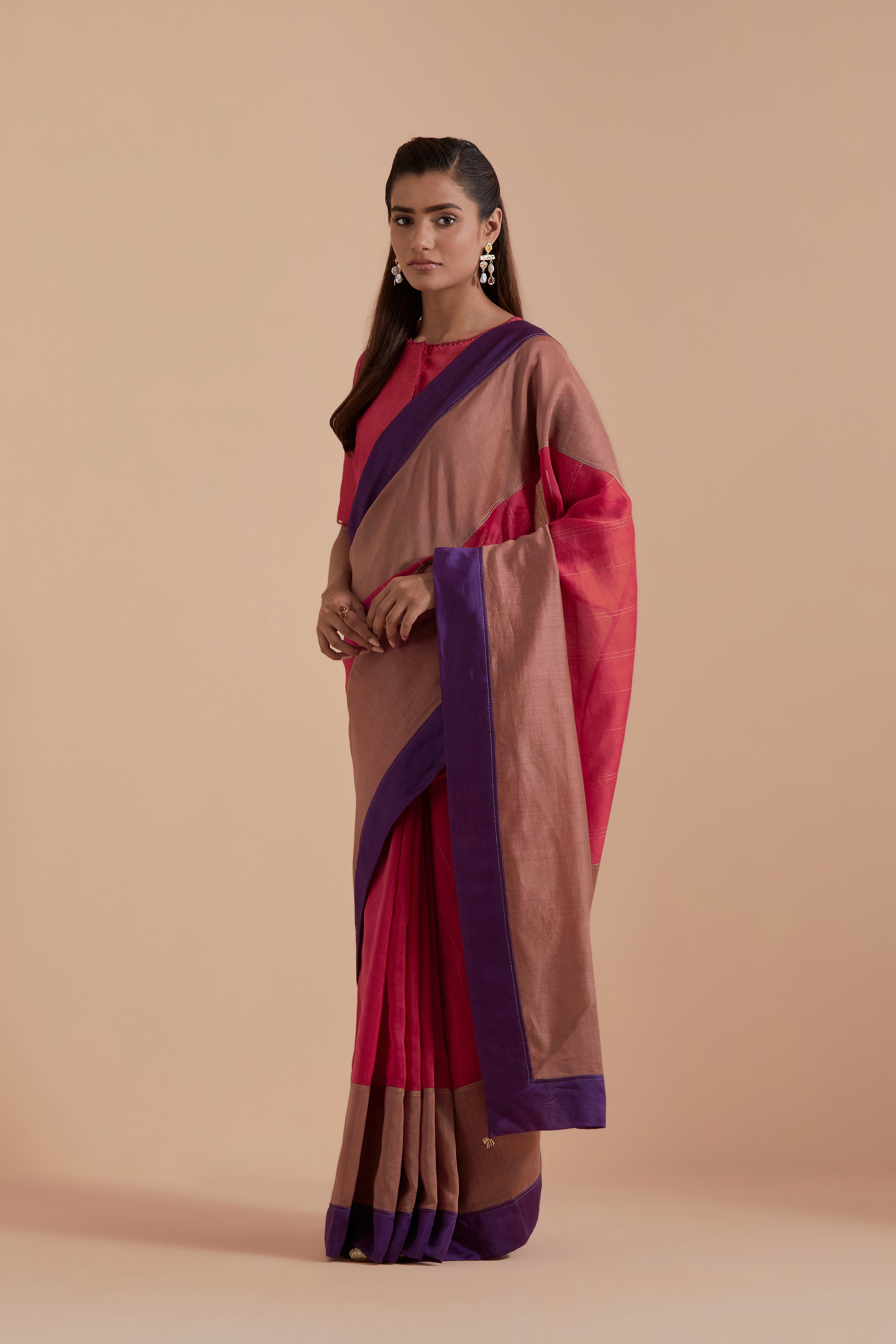 A silk Chanderi three-tone Carrot pink saree in a beautiful gradient effect featuring delicate golden zari quilting all over. Paired with Carrot pink silk Chanderi Quilted Organza & Brocade Floral Appliqué blouse.