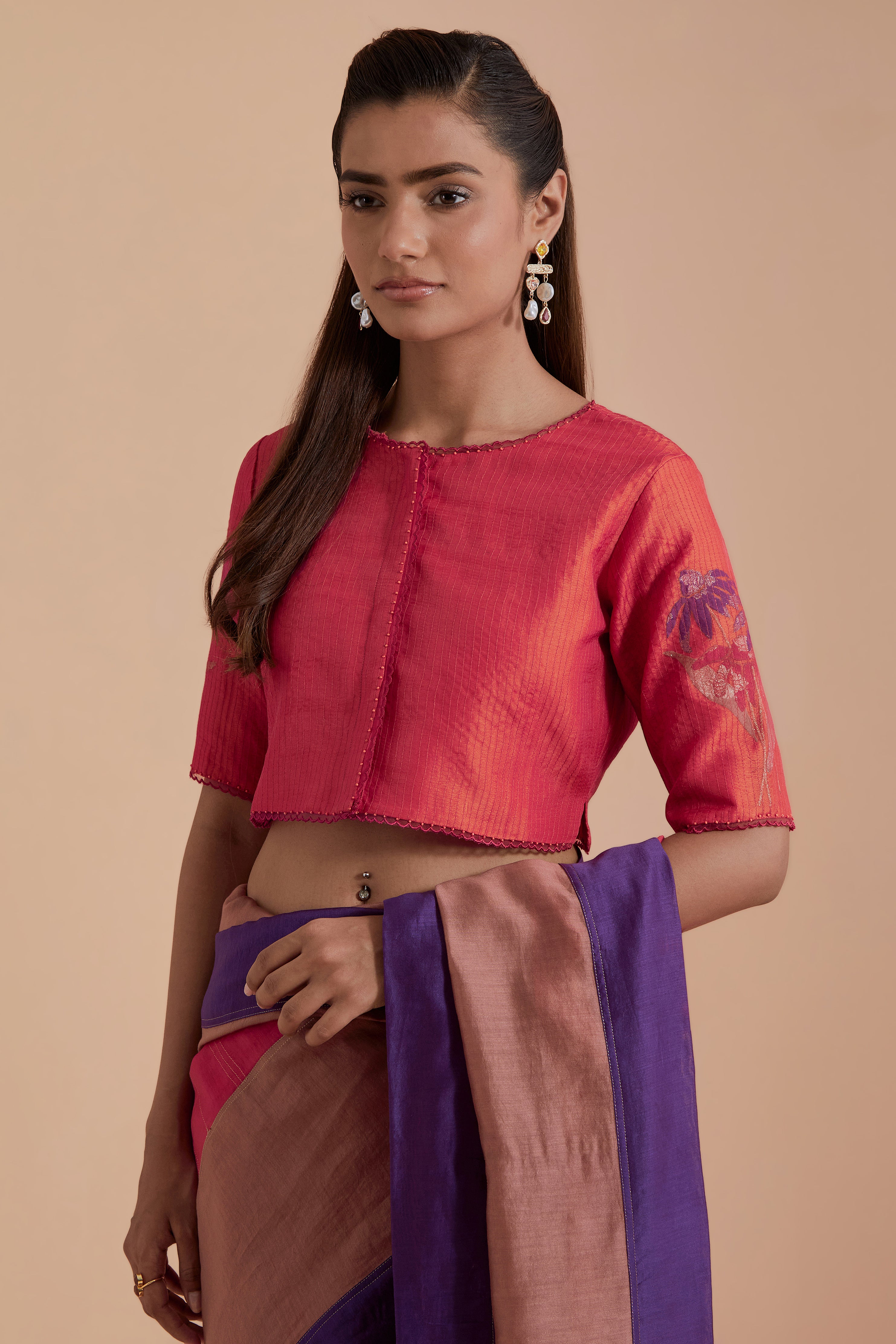 A silk Chanderi three-tone Carrot pink saree in a beautiful gradient effect featuring delicate golden zari quilting all over. Paired with Carrot pink silk Chanderi Quilted Organza & Brocade Floral Appliqué blouse.