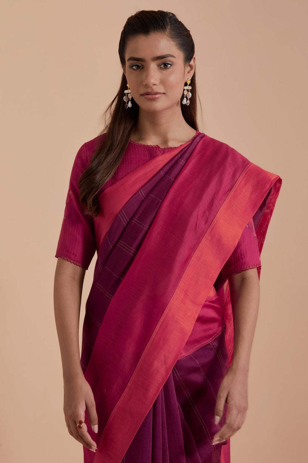 A silk Chanderi three-tone fuchsia saree in a beautiful gradient effect featuring delicate golden zari quilting all over. Paired with Fuchsia silk Chanderi Quilted Organza & Brocade Floral Appliqué blouse.