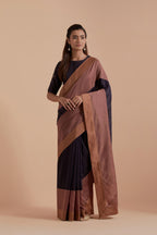 A silk Chanderi three-tone Dark Grey saree in a beautiful gradient effect featuring delicate golden zari quilting all over. Paired with Dark Grey silk Chanderi Quilted Organza & Brocade Floral Appliqué blouse.
