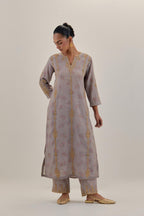 Lilac tissue chanderi straight kurta set with light gold dori embroidery, highlighted with multi color bead sequins work.