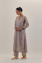 Lilac tissue chanderi straight kurta set with light gold dori embroidery, highlighted with multi color bead sequins work.