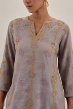 Lilac tissue chanderi straight kurta set with light gold dori embroidery, highlighted with multi color bead sequins work.