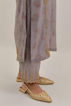 Lilac tissue chanderi straight kurta set with light gold dori embroidery, highlighted with multi color bead sequins work.