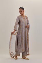 Lilac tissue chanderi straight kurta set with light gold dori embroidery, highlighted with multi color bead sequins work.