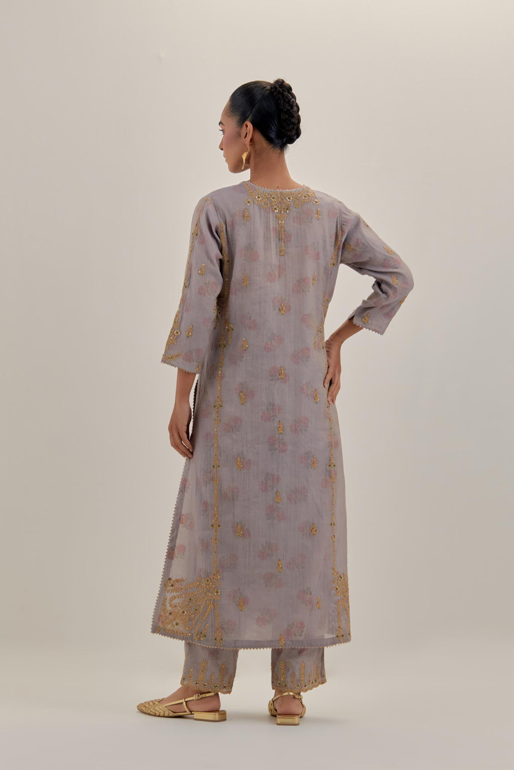 Lilac tissue chanderi straight kurta set with button placket neckline, highlighted with all-over light gold dori embroidery.