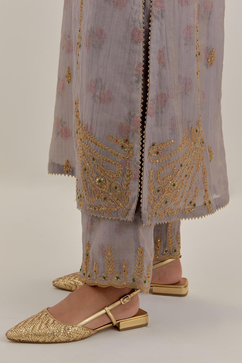 Lilac tissue chanderi straight kurta set with button placket neckline, highlighted with all-over light gold dori embroidery.