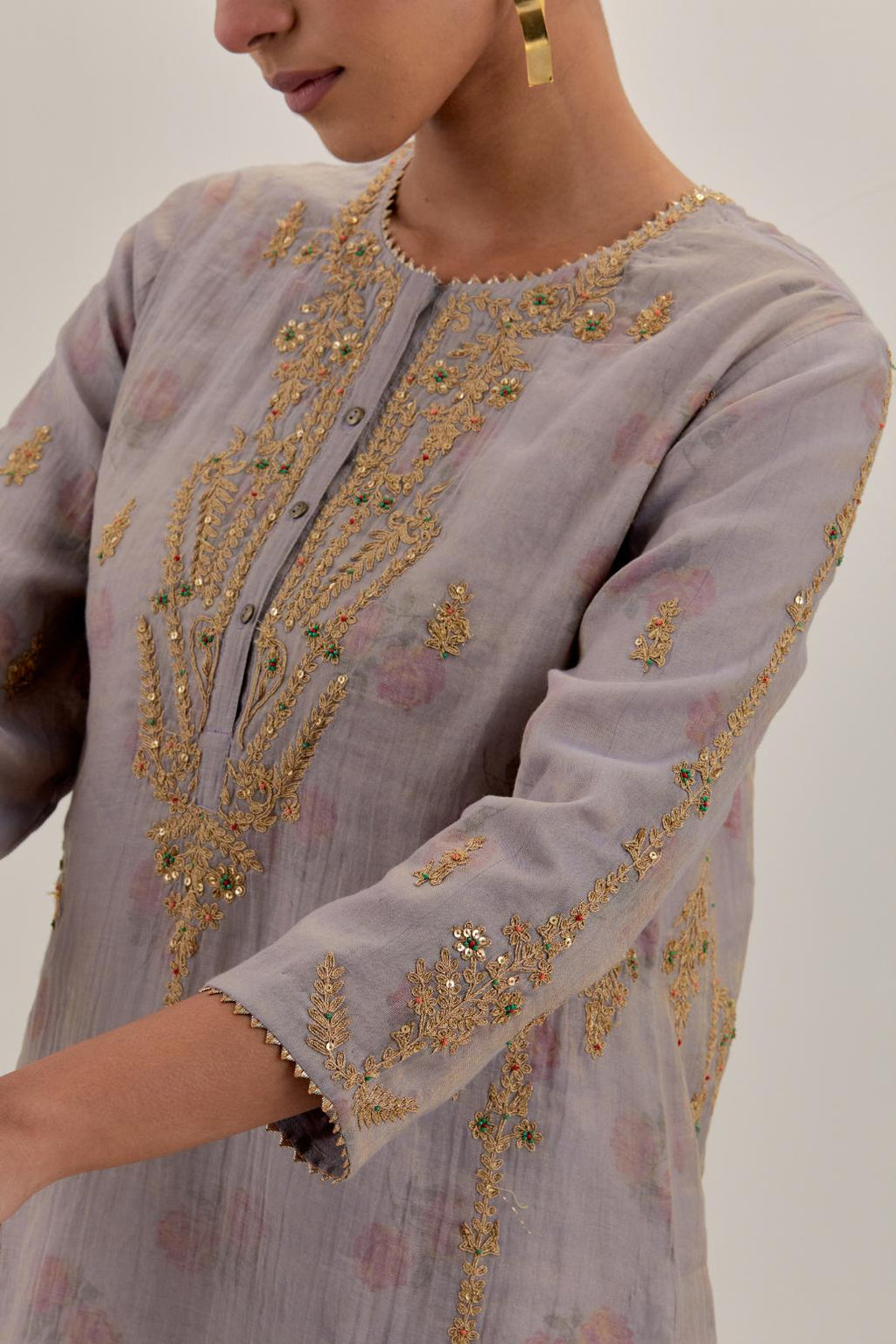 Lilac tissue chanderi straight kurta set with button placket neckline, highlighted with all-over light gold dori embroidery.