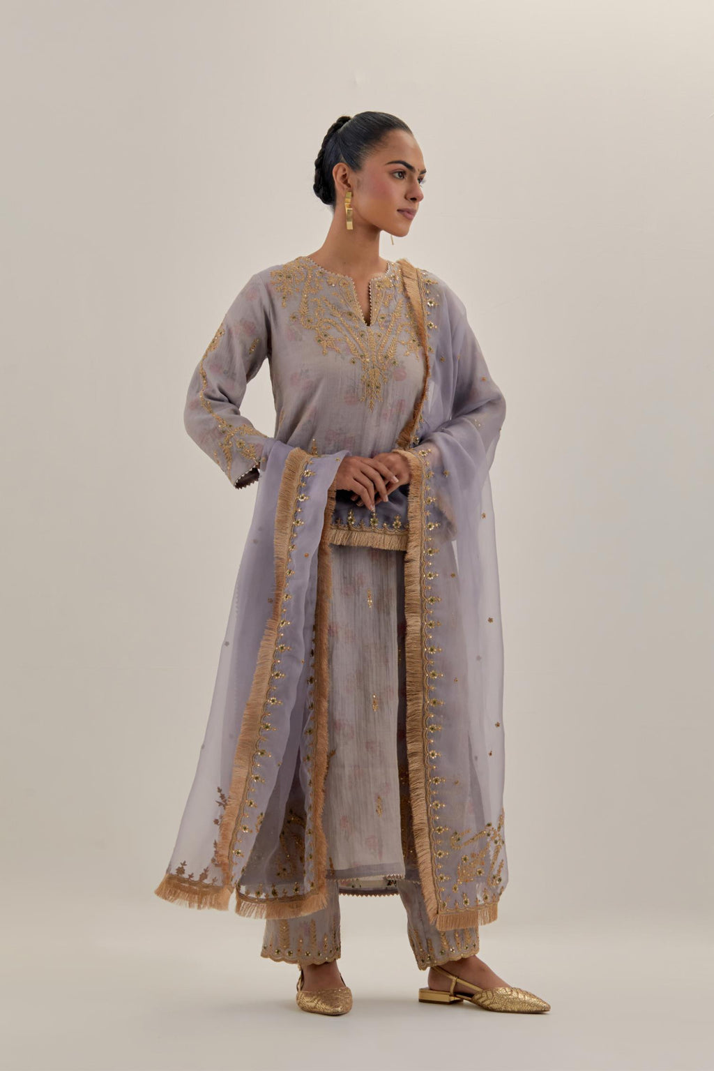 Lilac tissue chanderi straight kurta set, highlighted with light gold dori embroidery and hand block printed lining inside.