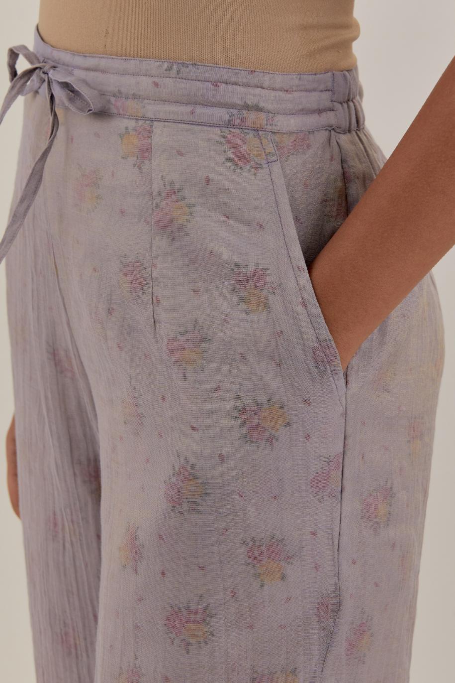 Lilac tissue chanderi straight pants with light gold dori embroidery at hem.