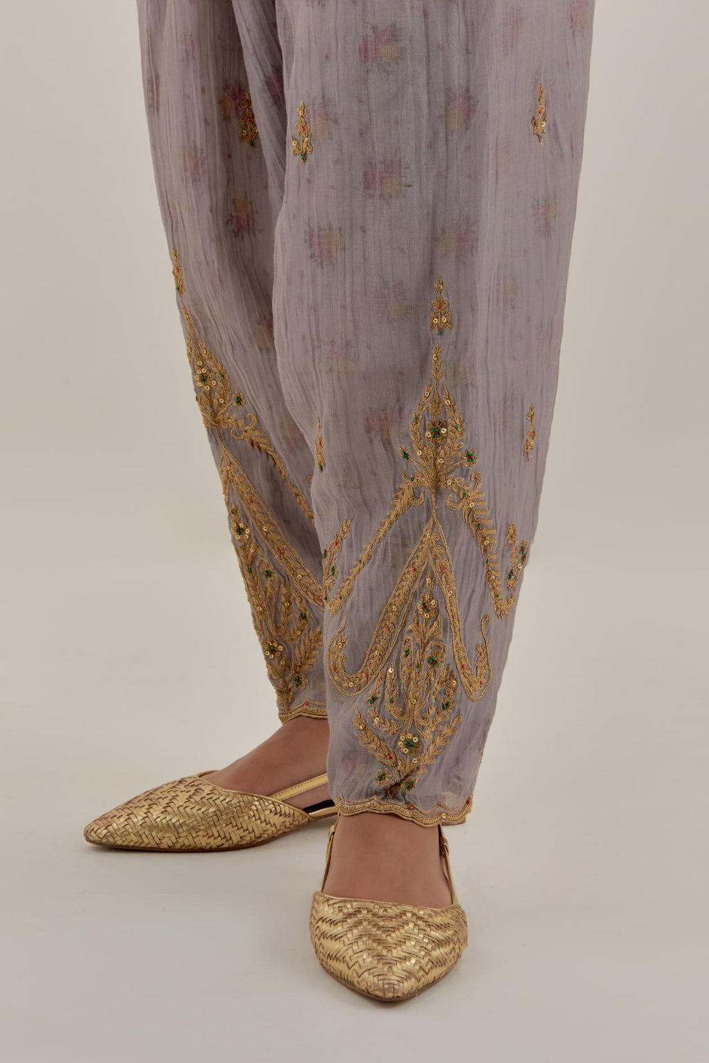 Lilac tissue chanderi salwar with gold dori embroidery, highlighted with multi beads & gold sequins.