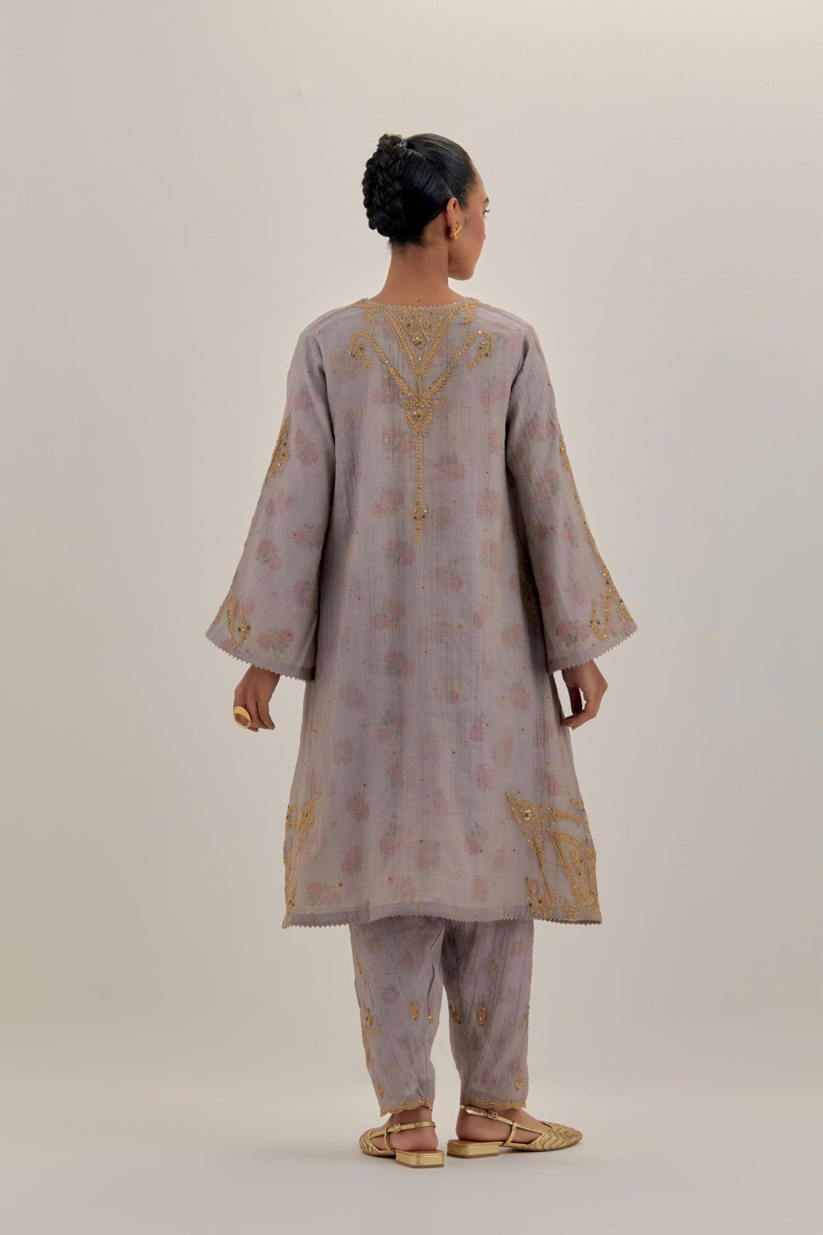 Lilac tissue chanderi A-line kurta set highlighted with light gold dori embroidery and hand block printed lining inside.