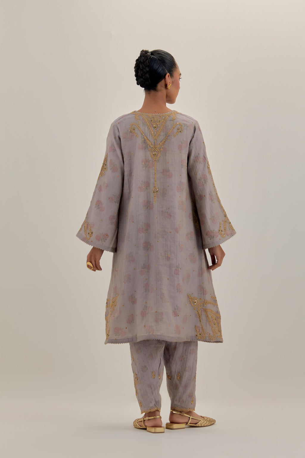 Lilac tissue chanderi A-line kurta set highlighted with light gold dori embroidery and hand block printed lining inside.