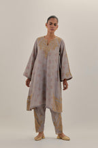 Lilac tissue chanderi A-line kurta set highlighted with light gold dori embroidery and hand block printed lining inside.