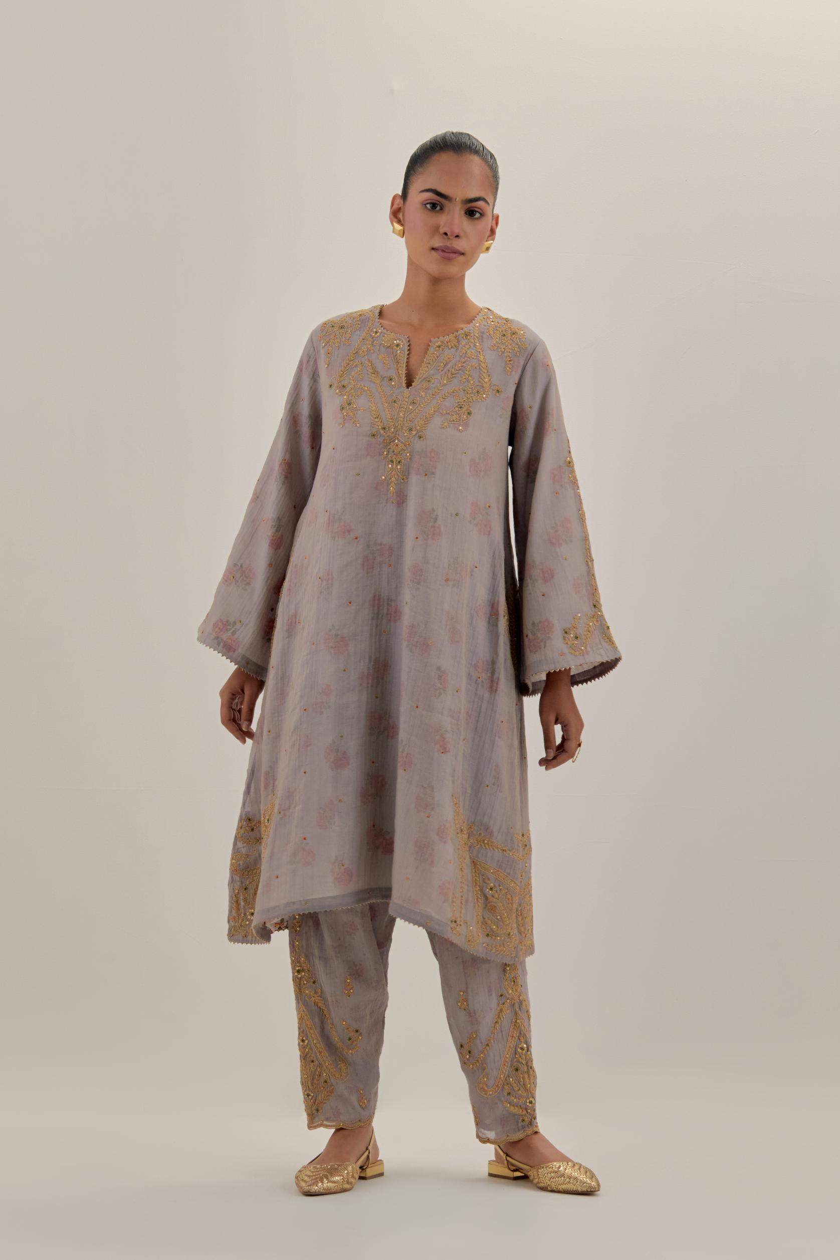 Lilac tissue chanderi A-line kurta set highlighted with light gold dori embroidery and hand block printed lining inside.