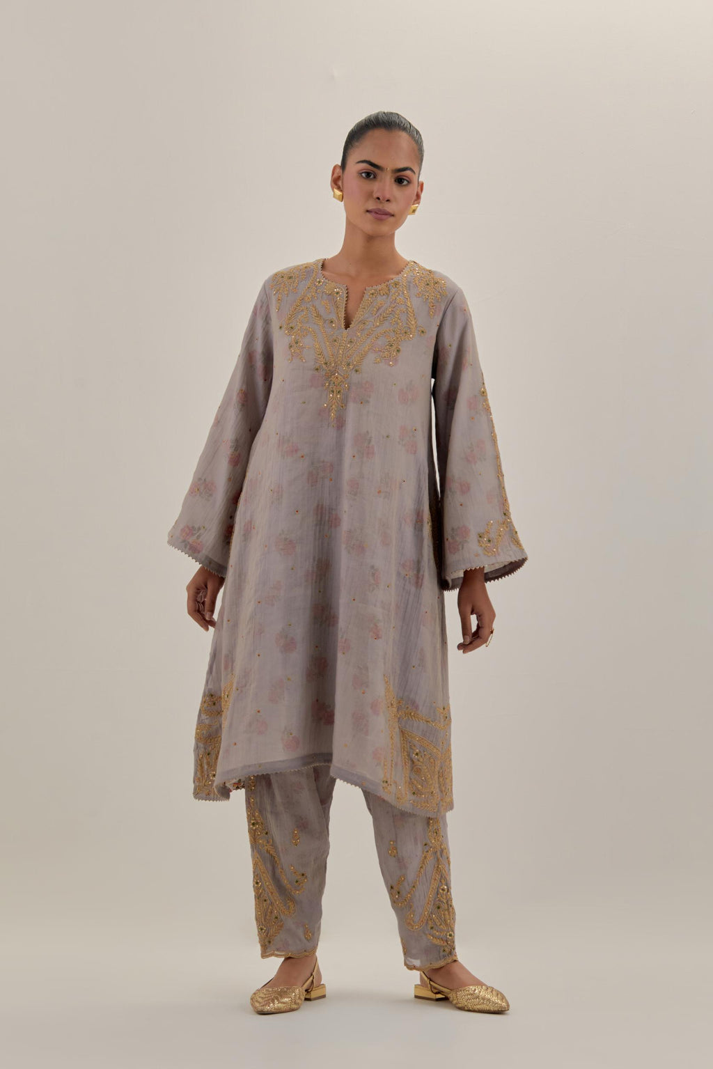 Lilac tissue chanderi A-line kurta set highlighted with light gold dori embroidery and hand block printed lining inside.