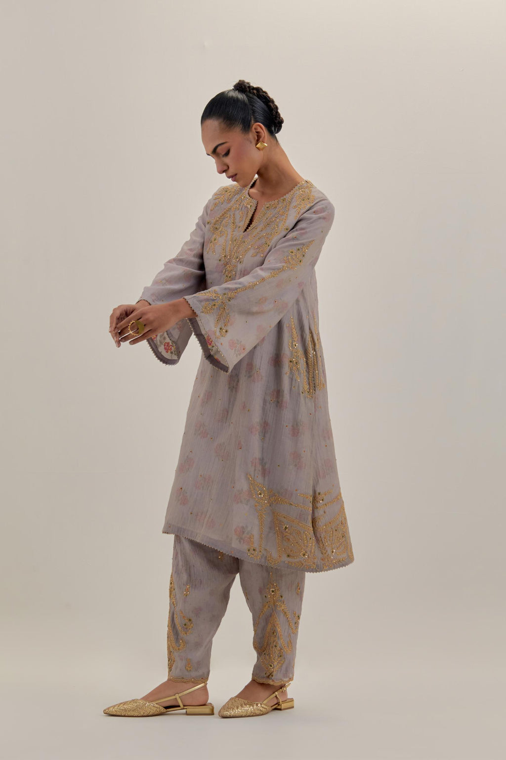 Lilac tissue chanderi A-line kurta set highlighted with light gold dori embroidery and hand block printed lining inside.