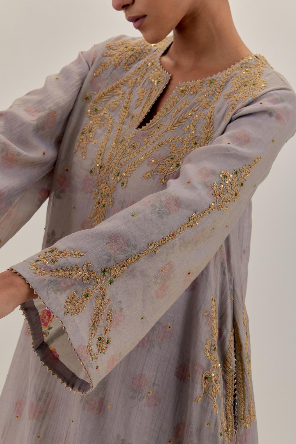 Lilac tissue chanderi A-line kurta set highlighted with light gold dori embroidery and hand block printed lining inside.