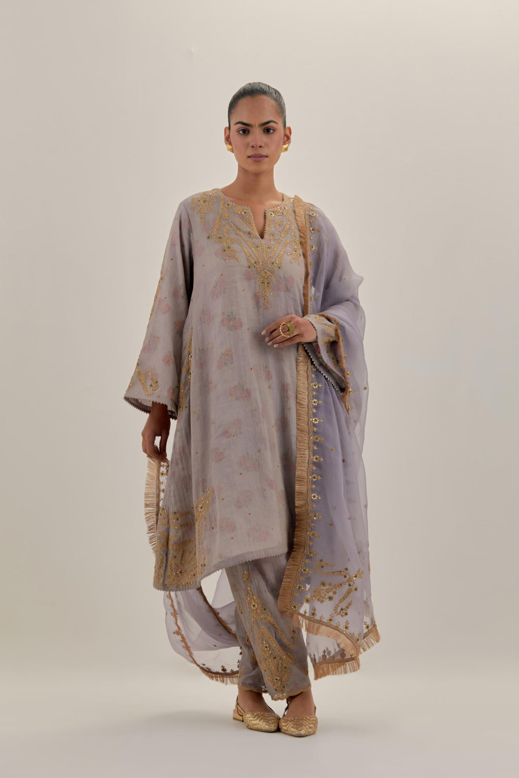 Lilac tissue chanderi A-line kurta set highlighted with light gold dori embroidery and hand block printed lining inside.