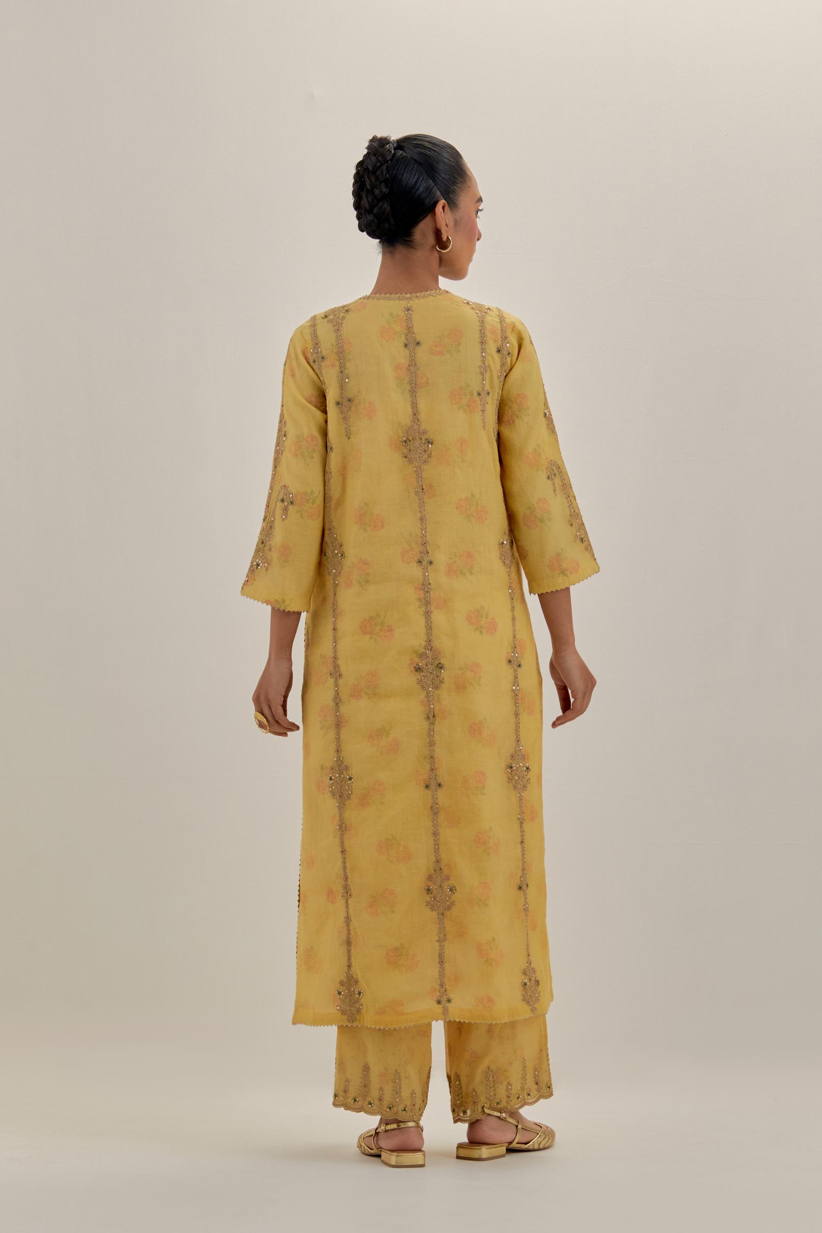Yellow tissue chanderi straight kurta set with light gold dori embroidery, highlighted with multi color bead sequins work.