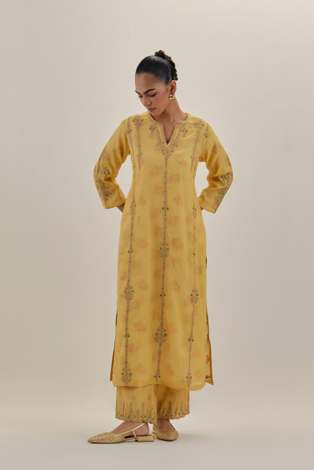 Yellow tissue chanderi straight kurta set with light gold dori embroidery, highlighted with multi color bead sequins work.