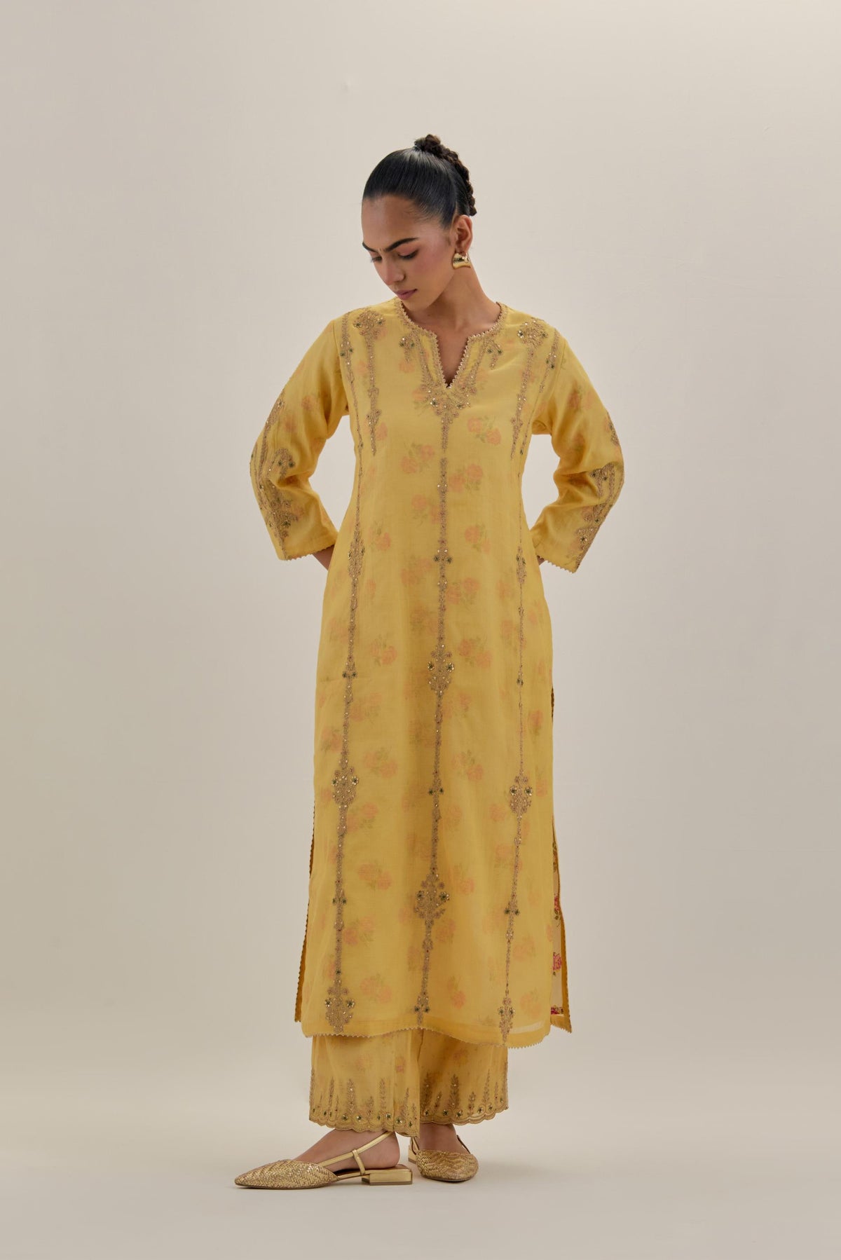 Yellow tissue chanderi straight kurta set with light gold dori embroidery, highlighted with multi color bead sequins work.