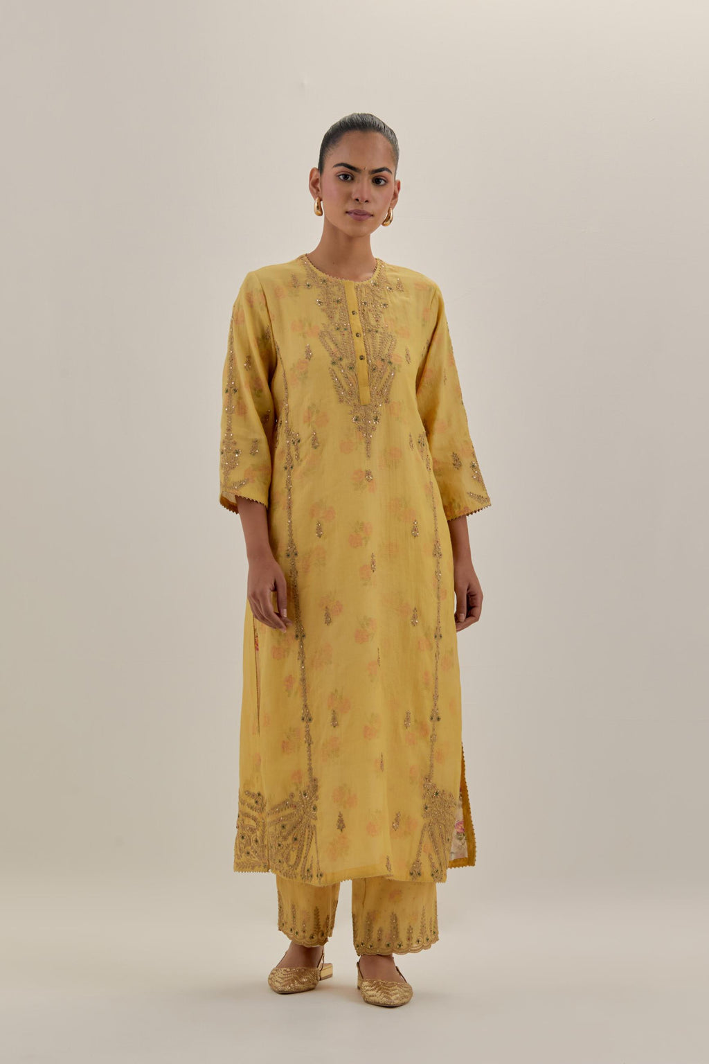 Yellow tissue chanderi straight kurta set with button placket neckline, highlighted with all-over light gold dori embroidery.