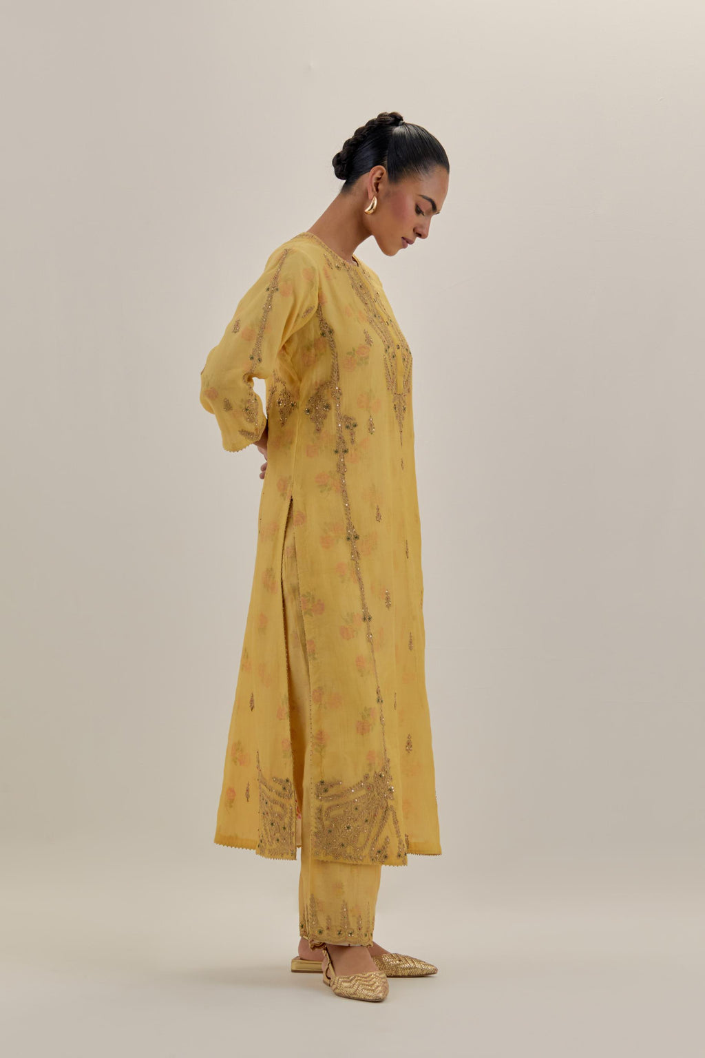 Yellow tissue chanderi straight kurta set with button placket neckline, highlighted with all-over light gold dori embroidery.